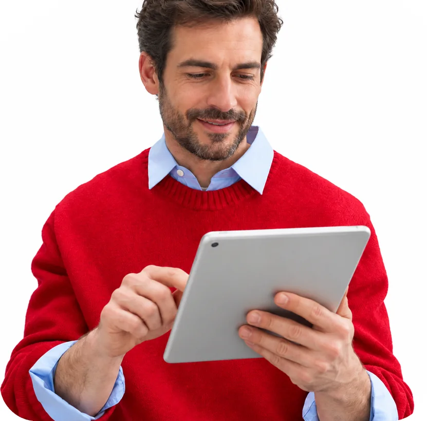 A seller in a red sweater reading product data on a tablet